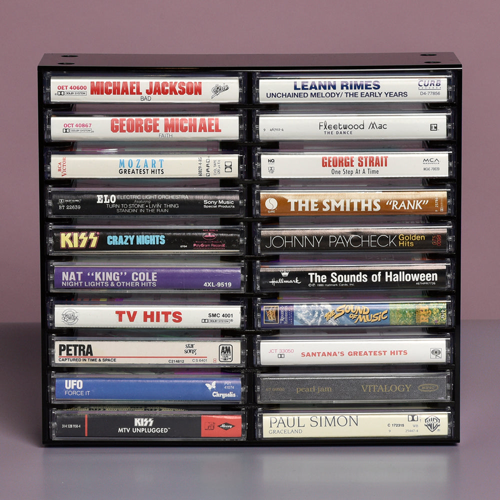selection of twenty vintage cassette tapes on rack