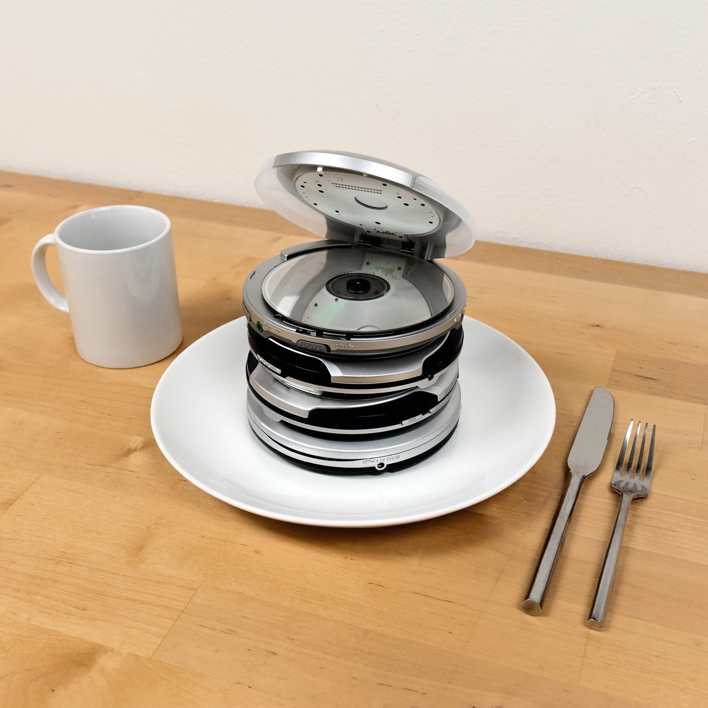 stack of cd players on a plate