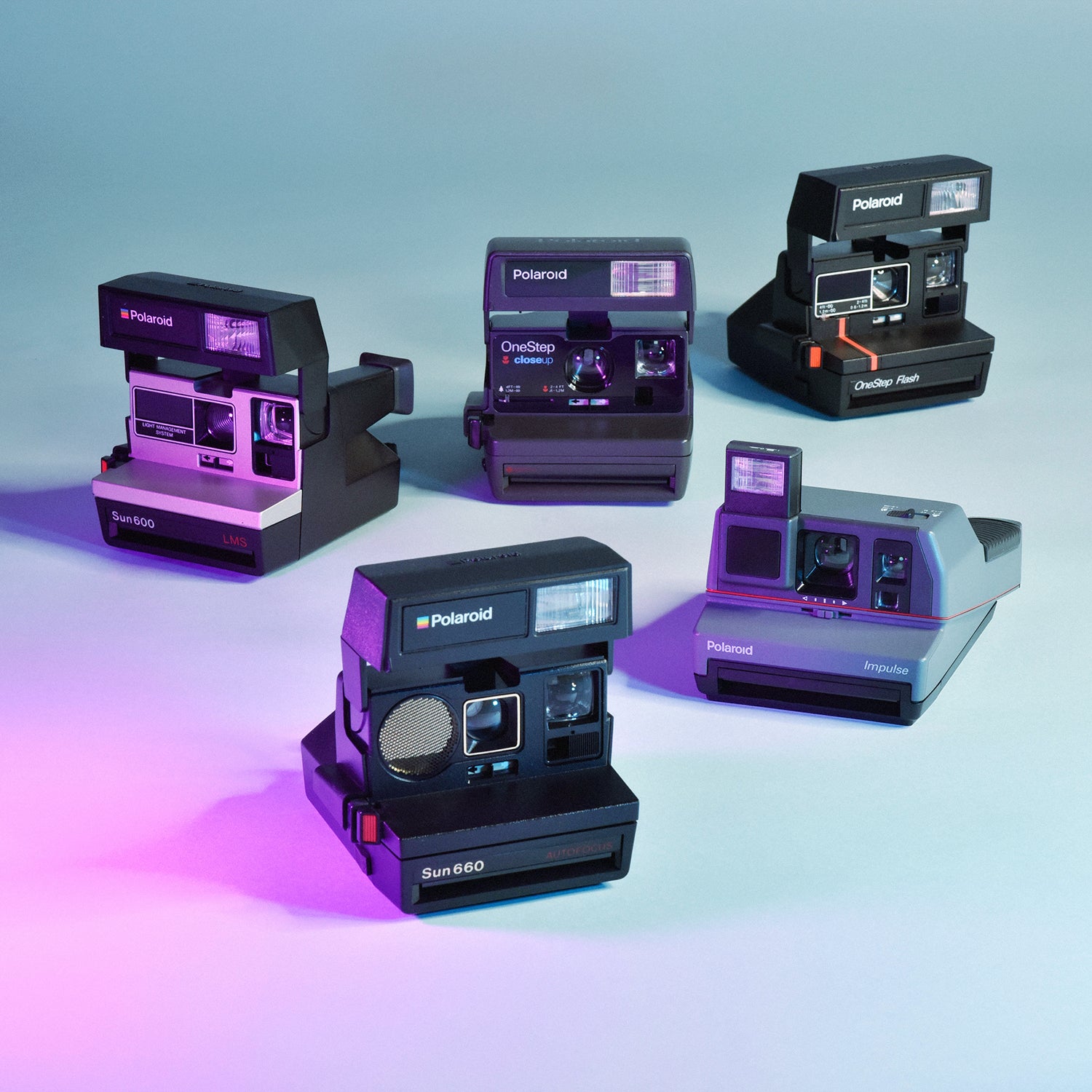 five vintage instant polaroid cameras
