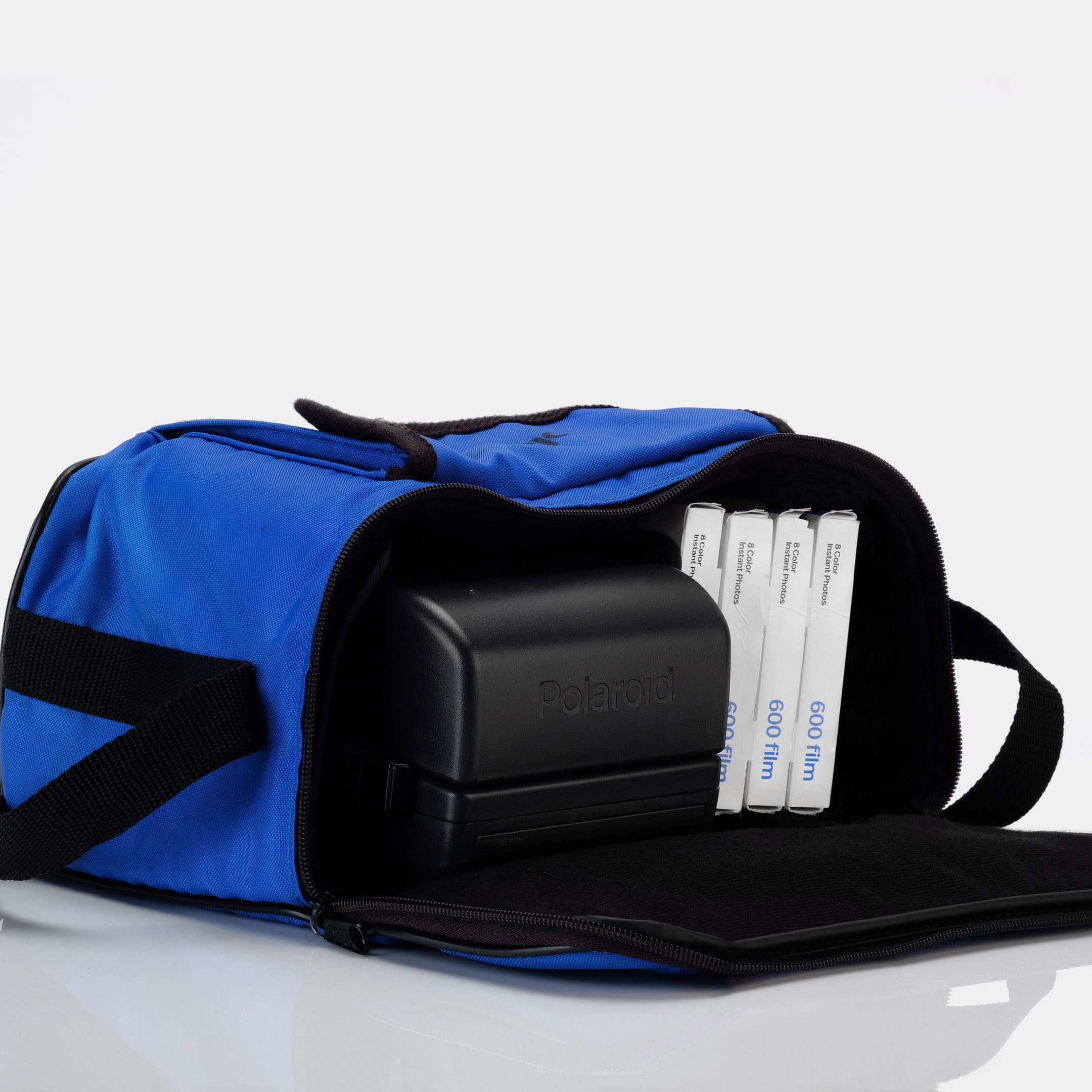 Blue Polaroid Camera and Film Bag