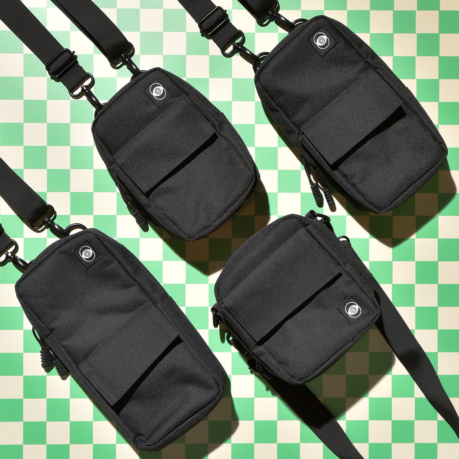 black instant camera bags on checker background